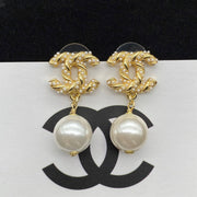 Gold pearl earrings