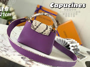 Purple python pattern handbag