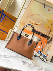 Leather and canvas combined handbag