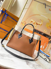 Leather and canvas combined handbag