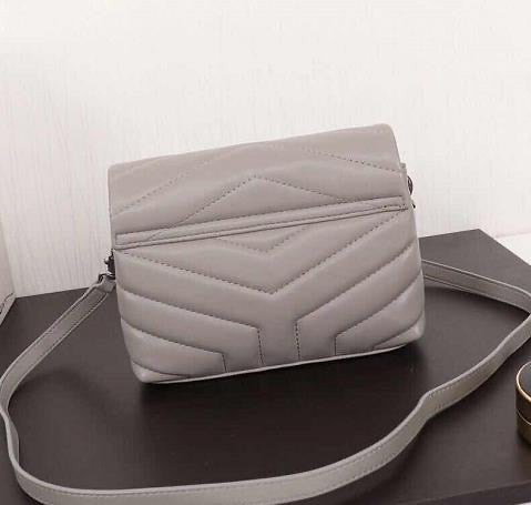 Handbag in  gray /silver color