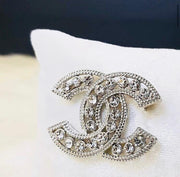 Chanel brooches