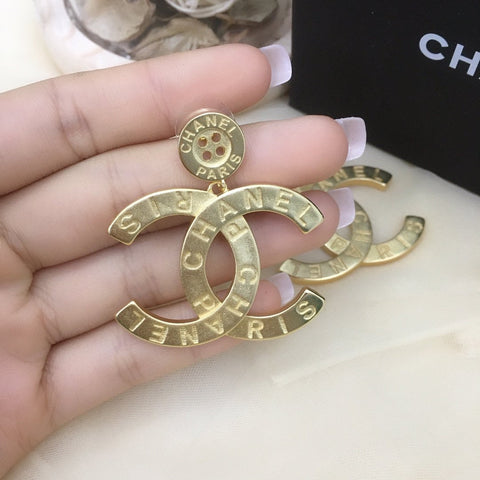 C ha earrings gold