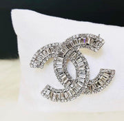 Chanel brooches