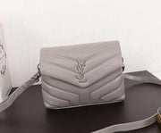 Handbag in  gray /silver color